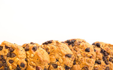 cookies with chocolate and hazelnuts on a white background