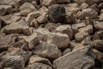 Cobblestones outdoors texture. Broken fireplaces in the street.Concrete road broken in. It is not standard

