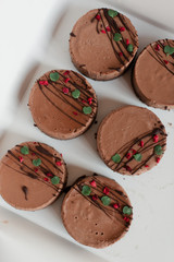 Chocolate brownies. The brownies are dark. The cakes are decorated. 