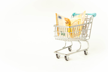 Small trolley with euro. Coronavirus crisis money stimulus policy, QE or money injection to aid economics and business to survive in COVID-19 outbreak
