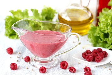 berry sauce with raspberries. salad  berry vinaigrette dressing. 
copy space