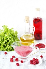 berry sauce with raspberries. salad  berry vinaigrette dressing. 
copy space