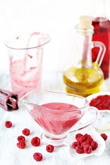 berry sauce with raspberries. salad  berry vinaigrette dressing. 
copy space