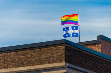Gay rainbow flag and Quebec flag