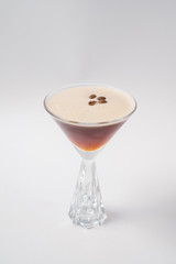 Making cocktails at home like an expert nightclub barman. Fresh and juicy colorful homemade cocktails garnished with berries, orange, mint and coffee on white background.