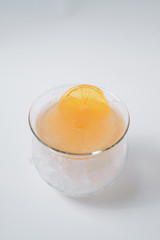 Making cocktails at home like an expert nightclub barman. Fresh and juicy colorful homemade cocktails garnished with berries, orange, mint and coffee on white background.