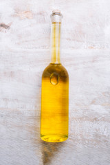 Various oil glass bottles on wooden background