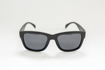 black men's sunglasses from a sun on a white