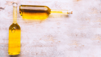 Various oil glass bottles on wooden background