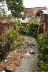 Recife / Pernambuco / Brazil. July, 31, 2015. Stream with garbage and dumping of construction debris in Bomba do Hemetério, a neighborhood on the outskirts of Recife.