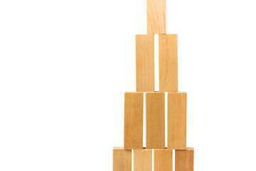 Row of wooden block tower game children isolated on white background