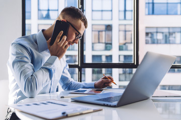 Presentable guy in formal clothes working in office