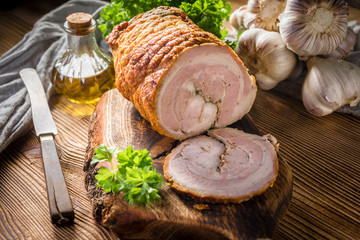 Baked rolled bacon with spices.