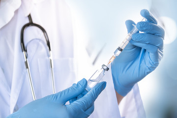 Doctor, nurse, scientist, researcher hand in blue gloves holding flu, measles, coronavirus,...