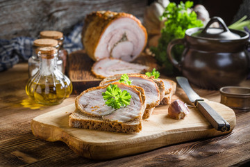 Tasty breakfast - dark bread with baked bacon.