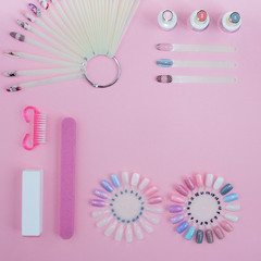 Nail care. set of professional manicure tools. Top view of manicure and pedicure equipment on pink background