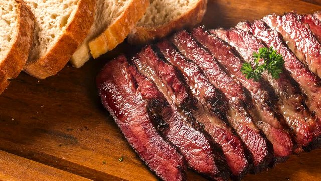 Slide shot Sliced brisket with bread. Smoke