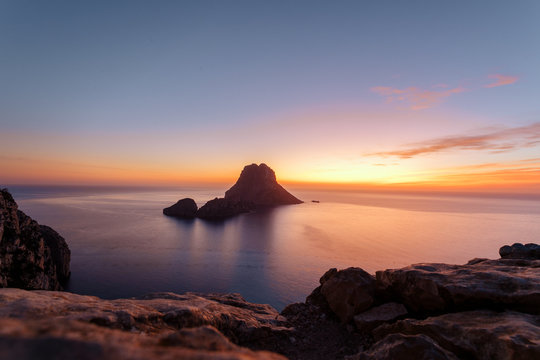 Es Vedra at the sunset, pastel colored sky at the mystic rock of Es Vedra, Ibiza Island.