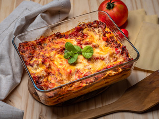 Lasagna ready to serve on wood table