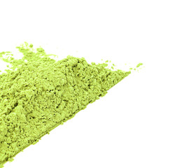 Green matcha powder on white background. Matcha made from finely ground green tea powder. Eat...