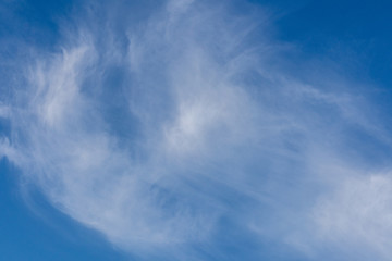 Clear blue sky with white clouds.