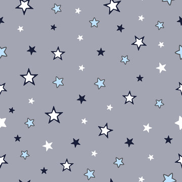 Seamless surface repeat vector pattern with light blue, navy blue and white little stars on a gray background