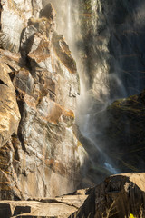 The water of the Bridalveil Fall hits on the rocks in the lower part of Yosemite National Park, California, USA.