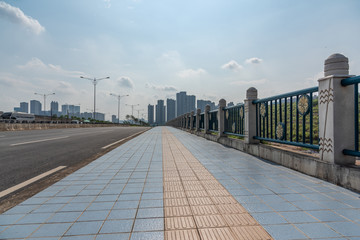 Low angle perspective view of urban sidewalk paving