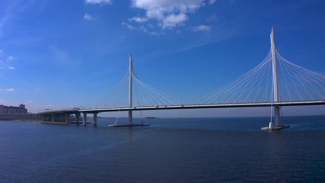 Aerial view of the bridge over the Petrovsky fairway. Western high-speed diameter of St. Petersburg. Drone flight over the city on a sunny day.