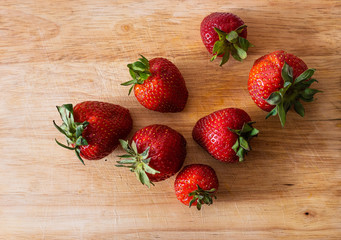 Strawberries on a wooden background. 