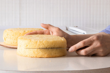 Cutting the cake on layers. Making of sponge cake. Series