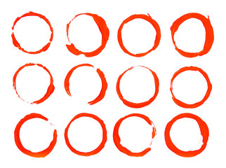 red circular brushstroke or circle print. white paint on a black background