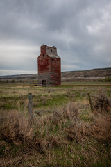 An old abandoned grain elevator in the badlands of Alberta.