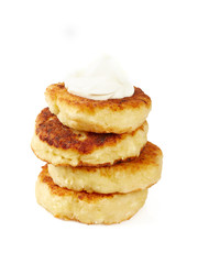 cottage cheese pancakes (syrniki) isolated on white background
