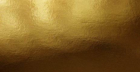 Gold foil gradient texture background with uneven surface