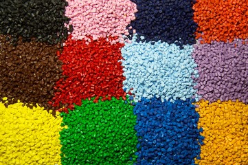 Colorful  polymer granules used as raw material in plastic industry 