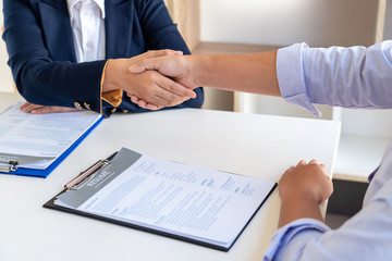 Good deal. Close-up of beautiful women business people shaking hands while successful job interview or Job applicant in modern office