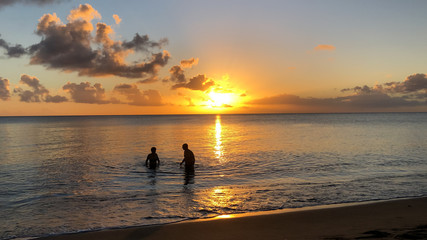 Naklejka na ściany i meble Silhouettes Sunset at the Martinique Beach