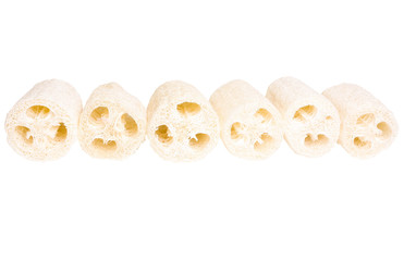 Natural loofah on a white background. - obrazy, fototapety, plakaty
