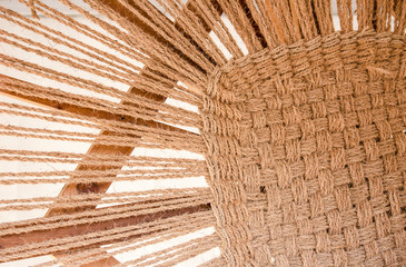 Creating process of a rustic burlap pattern texture. Individual fibers and threads are visible.