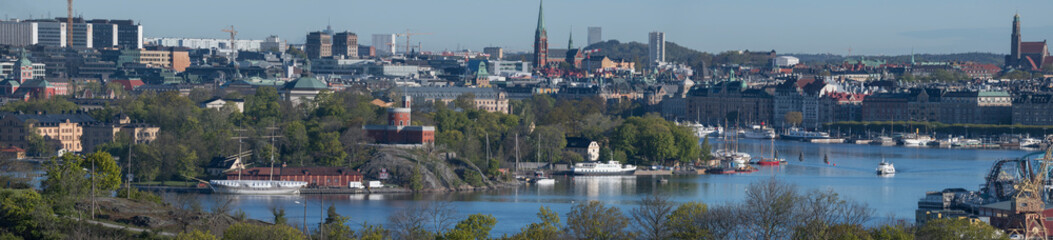 Fototapeta na wymiar High view over the inner harbor of Stockholm, sky line with islands and boats.