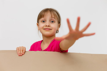 Happy girl opening present. Child excited with Christmas holiday gift concept. Kid looking inside cardboard box view. Teenager getting birthday surprise idea. Person with cheerful expression
