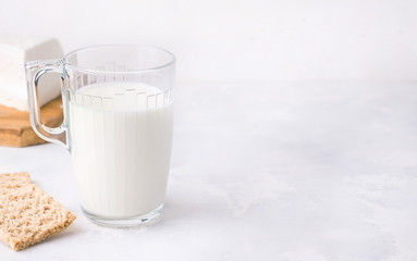 Fermented milk drink kefir in a cup on a white background. Copy space