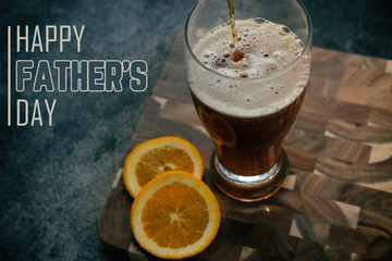 Happy Father's Day background with beer pour for holiday celebration of dad.