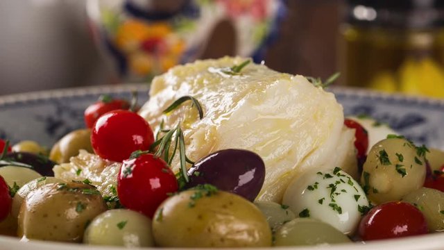 Slide shot codfish on the plate with smoke. 