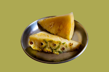 pineapple slices isolated on steel plate