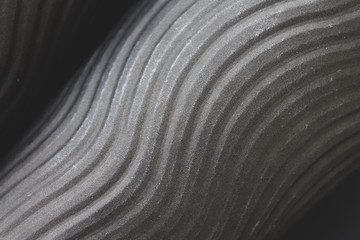 Black monochrome abstract background with volumetric diagonal spiral lines texture. Stylish backdrop for your design work, cards, wallpapers