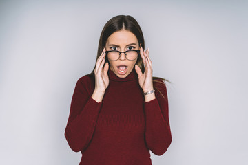 Surprised female with hands on face