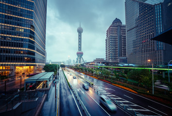 Fototapeta na wymiar wet road in Shanghai Lujiazui financial center, China