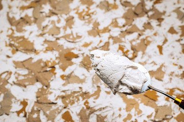 White putty, putty knives and spatulas.